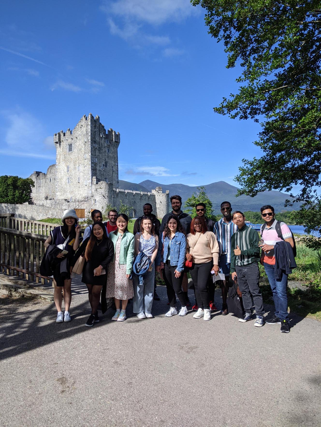 Students standing together outside of Ross castle in Killarney, Ireland