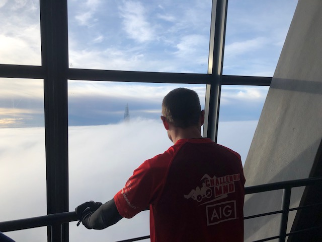 Alex on the top floor overlooking the clouds and the Shard
